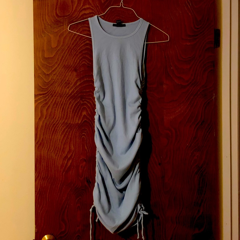 Light blue body in dress with side ties at bottom